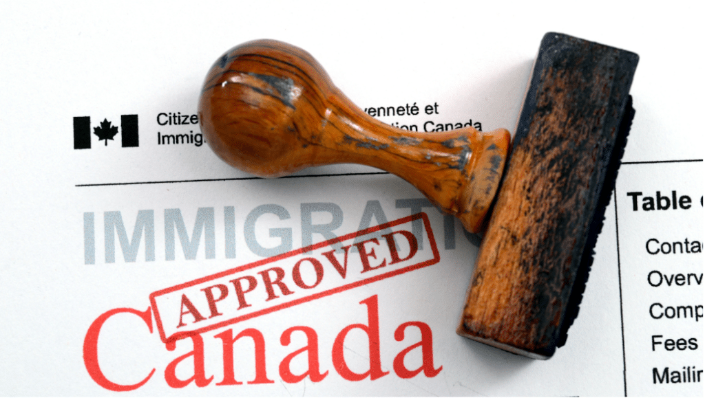 Graphic showing approval stamp on immigration papers.